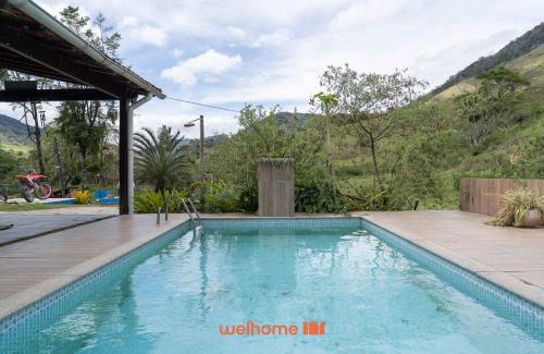 Macae Apartamento | Suite em Macae com vista lago e piscina