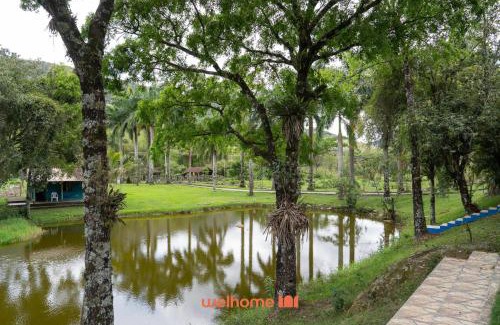 Macae Apartamento | Suite em Macae com vista lago e piscina