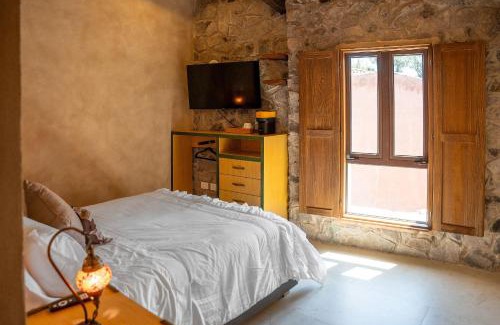 Santeagueda Apartamento | Suite Raffaello: Diseño y Comodidad en Val'Quirico