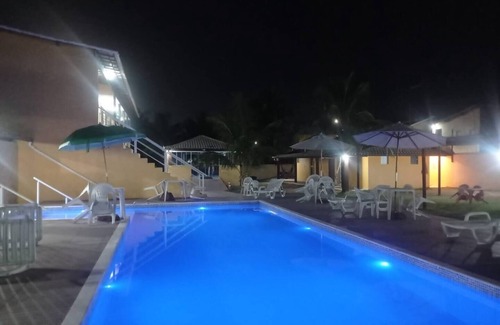 Barra Nova Apartamento | Suite with queen-size bed, smart TV, air conditioning, minibar and bidet