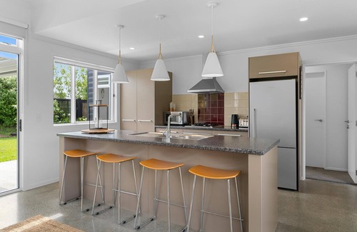 Mangawhai Casa | Sun Central - Modern, sunny holiday home in tranquil garden setting
