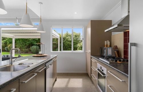 Mangawhai Casa | Sun Central - Modern, sunny holiday home in tranquil garden setting