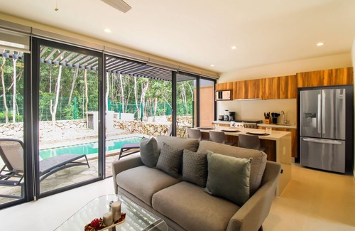 Tulum Casa | Sun-filled & dog-friendly resort home with outdoor pool, gym, patio, & courts