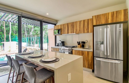 Tulum Casa | Sun-filled & dog-friendly resort home with outdoor pool, gym, patio, & courts