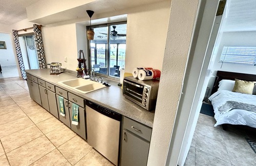 Lochmoor Waterway Estates Casa | Sunny Canal-Front Home w/ Lanai & Grill!