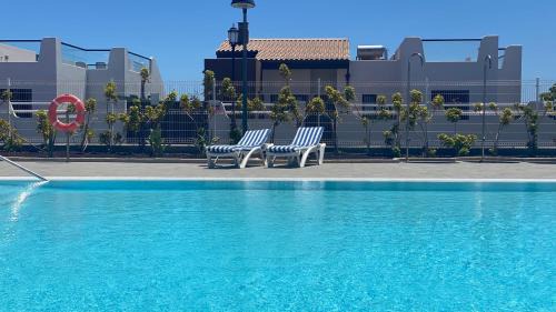 Caleta de Fuste Apartamento | Sunny Luxury Apartment with two great sunny - level terraces, two swimming pools, in a new complex Pueblo Majorero, close to Fuerteventura Golf Club, next to the beach , Atlantico Shopping Mall and casino in Caleta de Fuste
