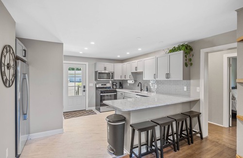 La Porte Casa | Sunset Shores - Lakefront Home with Hot Tub and Fire Pit