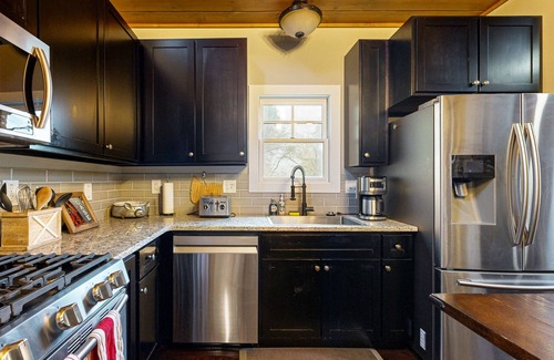 Cullowhee Casa | Take in the natural beauty from this elegant riverfront home