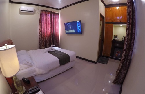 Buhangin Cama Y Desayuno | The Executive Villa Inn & Suites