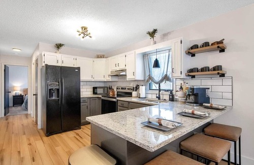 Wichita Casa | The Lodge is a spacious 4 bed, 2.5 bath home, styled with mountain/ lodge decor