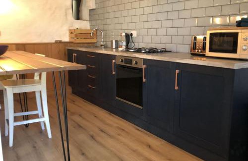 Treharris Casa | The Milking Parlour at Berthllwyd