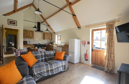 Nunney Casa | The Old Parlour - timber clad cosy converted cow shed