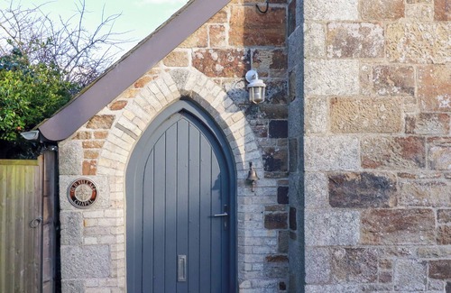 Crantock Cabaña | THE OLD VILLAGE CHAPEL, pet friendly, with open fire in Crantock