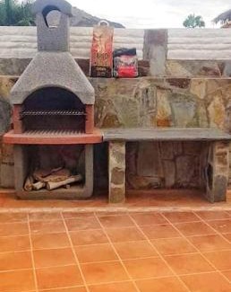 Mogan Apartamento | The perfect place to relax Bedroom with hot tub, beautiful tropical garden area. Bbq and big open spaces through all the house.It is located in a quiet place, but still 5 min away from the touristic Puerto Rico and walking distance from the beach