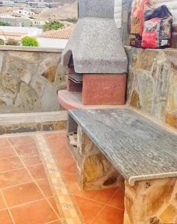 Mogan Apartamento | The perfect place to relax Bedroom with hot tub, beautiful tropical garden area. Bbq and big open spaces through all the house.It is located in a quiet place, but still 5 min away from the touristic Puerto Rico and walking distance from the beach