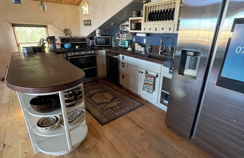 Walden Casa | The Walden House; cozy strawbale 3-bedroom home with fitness room & Hot Tub.