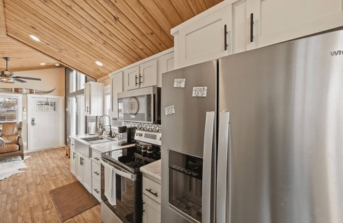 Fredericksburg Cabaña | Black Western-Themed Tiny Home 'The Willie' Offers Luxe Hideout Near Luckenbach's Live Music Scene w