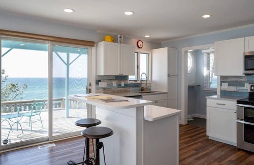 Mears Casa | This charming vacation home sits directly on Lake Michigan and it delivers!