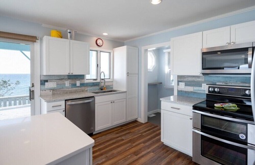 Mears Casa | This charming vacation home sits directly on Lake Michigan and it delivers!