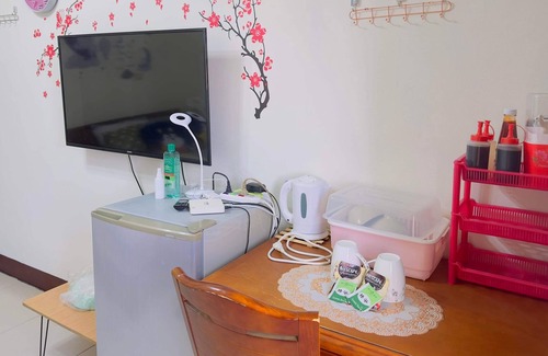 Hukou Apartamento | This room have its own private bathroom, bed, cabled tv, wardrobe and balcony.