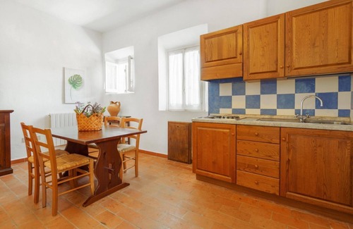 Pian dei Mucini Apartamento | Three-room apartment on the ground or first floor in rustic style of approximately 40 m2 furnished in a simple but functional way and located in the village in a large park.It is composed of a living room with sofa and flat-screen television, kitchenette