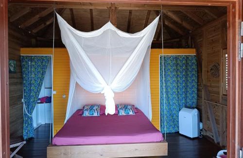 Grand Anse Casa | TI KAZ ANOLI Cottage en bois avec vue sur la baie