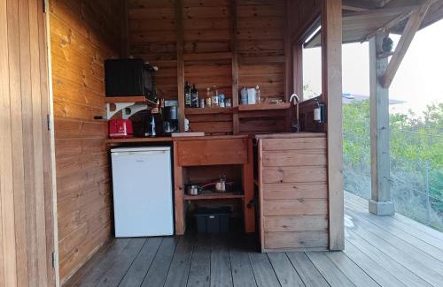 Grand Anse Casa | TI KAZ ANOLI Cottage en bois avec vue sur la baie