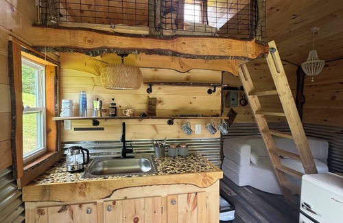 Hillsville Cabina | Tiny cabin sits by a bubbling, stocked creek. Pet friendly for a fee, hot tub