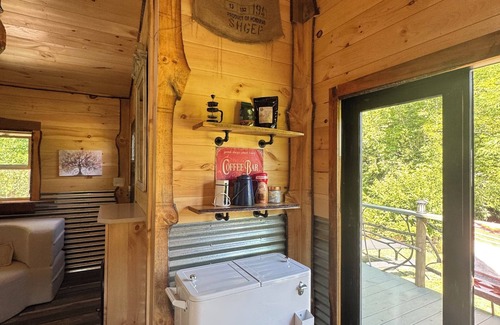 Hillsville Cabina | Tiny cabin sits by a bubbling, stocked creek. Pet friendly for a fee, hot tub