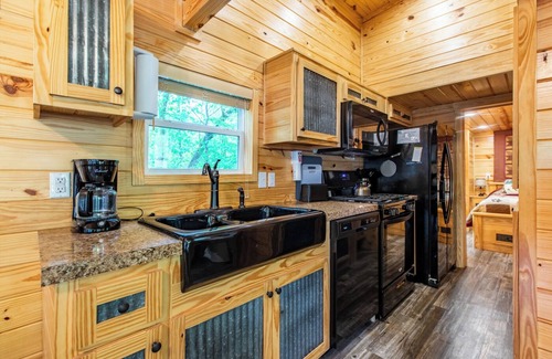 Nevis Casa | Tiny house nestled in the woods with lake view. Pets Accepted!