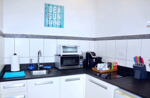 Pelican Key Apartamento | Parte superior de Pelican Key! Espectaculares vistas al mar, cerca de playas, wifi, estacionamiento, privado