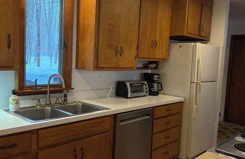 Alden Cabaña | Torch lake waterfront:100 ft of sandy beach, 3-bedroom, 3-bath cottage