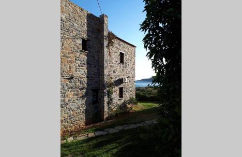 Gortyna Casa | Traditional stone house by the sea.