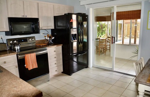 Fowlers Casa | Tropical Island House, Heated Pool, Near Beach, Disney, Kennedy Space Center
