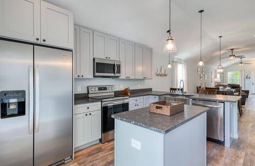 Butler Beach Casa | Tropical Winds - Heated Pool & Firepit! Walk to the Beach!