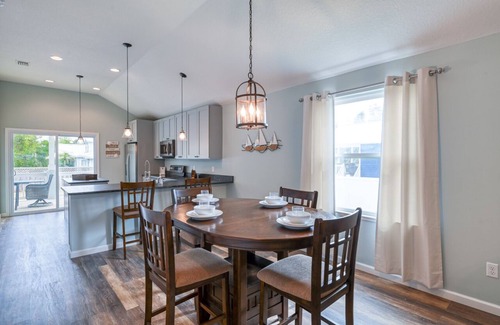 Butler Beach Casa | Tropical Winds - Heated Pool & Firepit! Walk to the Beach!