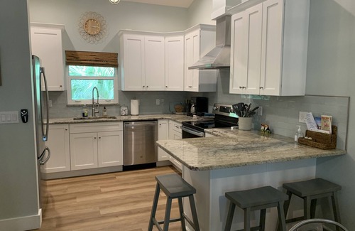 Englewood Casa | Tucked Away on Wooded Way located blocks from Manasota Beach with Heated Pool.