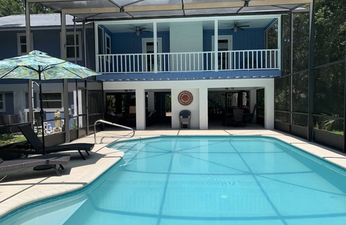 Englewood Casa | Tucked Away on Wooded Way located blocks from Manasota Beach with Heated Pool.