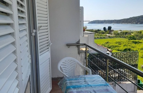 Suha Punta Apartamento | Apartamento para dos personas con terraza y vista al mar Kampor, Rab (A-4984-a)