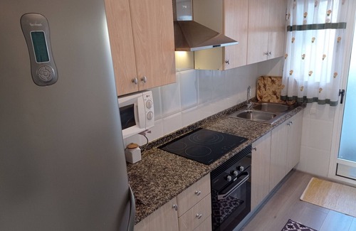 Playa de Xeraco Apartamento | Dos dormitorios en planta baja, patio con barbacoa, piscina y pista de tenis.