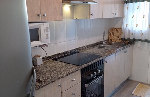 Playa de Xeraco Apartamento | Dos dormitorios en planta baja, patio con barbacoa, piscina y pista de tenis.