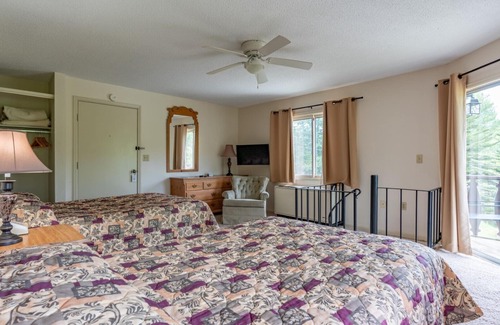 Beech Mountain Hotel | Two Level Condo Spiral Staircase, Kitchen, Living Room