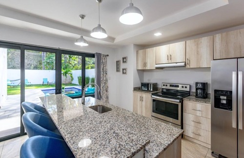 Potrero Villa | Ultramodern Townhome with an Inviting Coastal Design and Lush Outdoor Oasis with a Private Pool