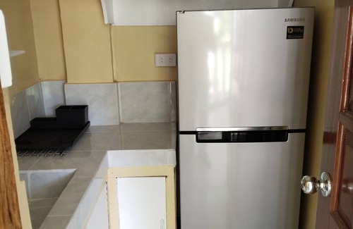 Yumbing Condominio | UNIT 1-Ground Floor-Holds 4pax Fully furnished kitchen, hot & cold showers.