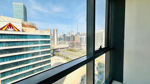 Business Bay Casa | Upscale Apartment at Oval Tower Near Downtown with Balcony and Parking by Belvilla