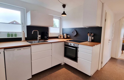 Kalifornien Apartamento | Vacation apartment "Achtern Diek 3" 1st row on the Baltic Sea coast, dog-friendly