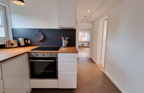Kalifornien Apartamento | Vacation apartment "Achtern Diek 3" 1st row on the Baltic Sea coast, dog-friendly