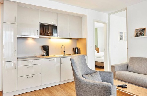 Bensersiel Apartamento | Vacation apartment close to the beach with large balcony incl. use of swimming pool & sauna -