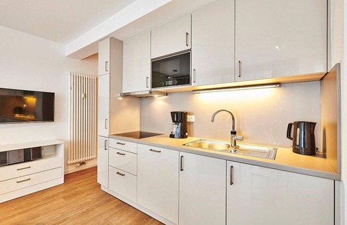 Bensersiel Apartamento | Vacation apartment close to the beach with large balcony incl. use of swimming pool & sauna -