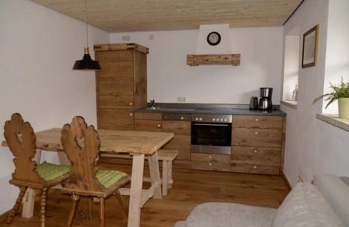 Brannenburg Apartamento | Apartamento de 40 metros cuadrados con dormitorio, sala de estar / dormitorio, cocina americana, baño / WC